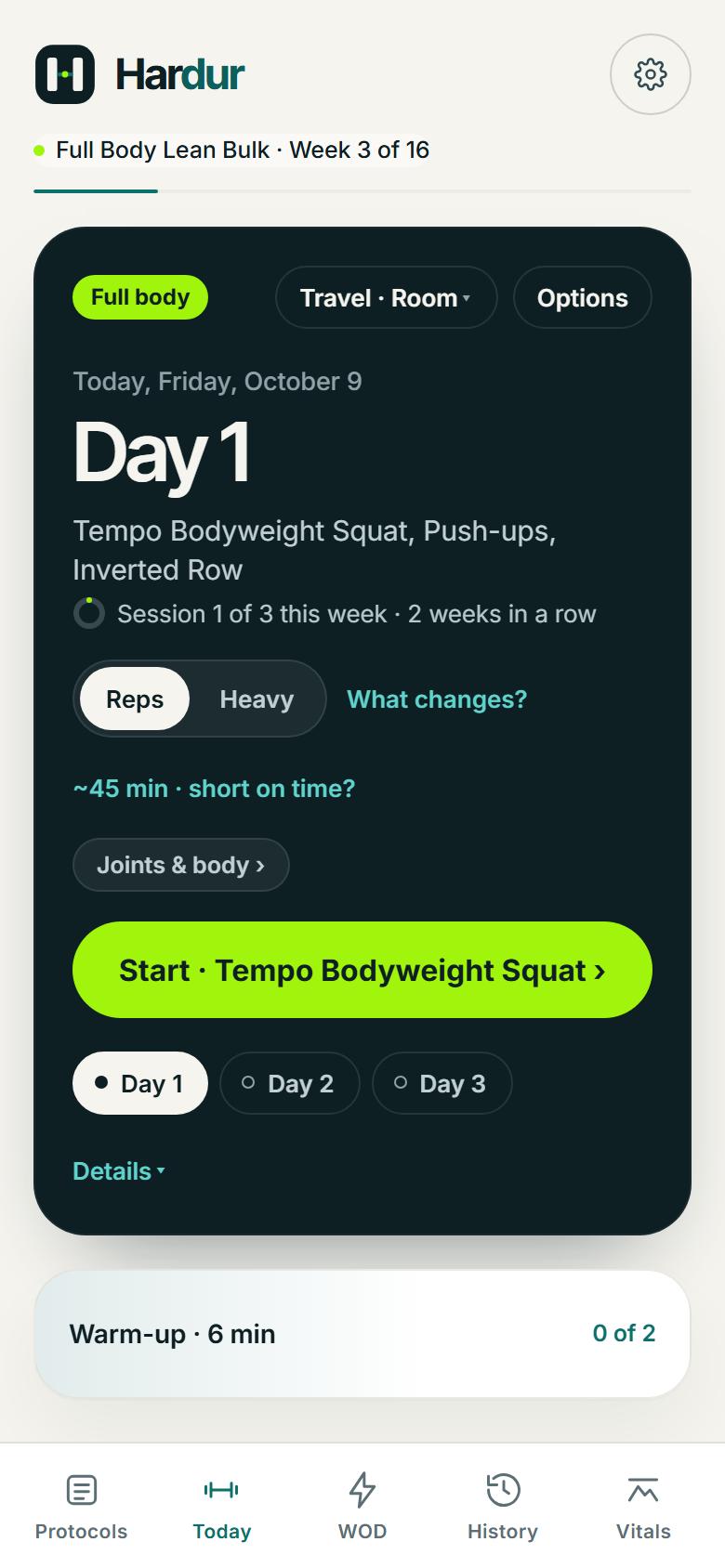 The same Day 1 session in Travel mode, Room: tempo bodyweight squats, push-ups and inverted rows
